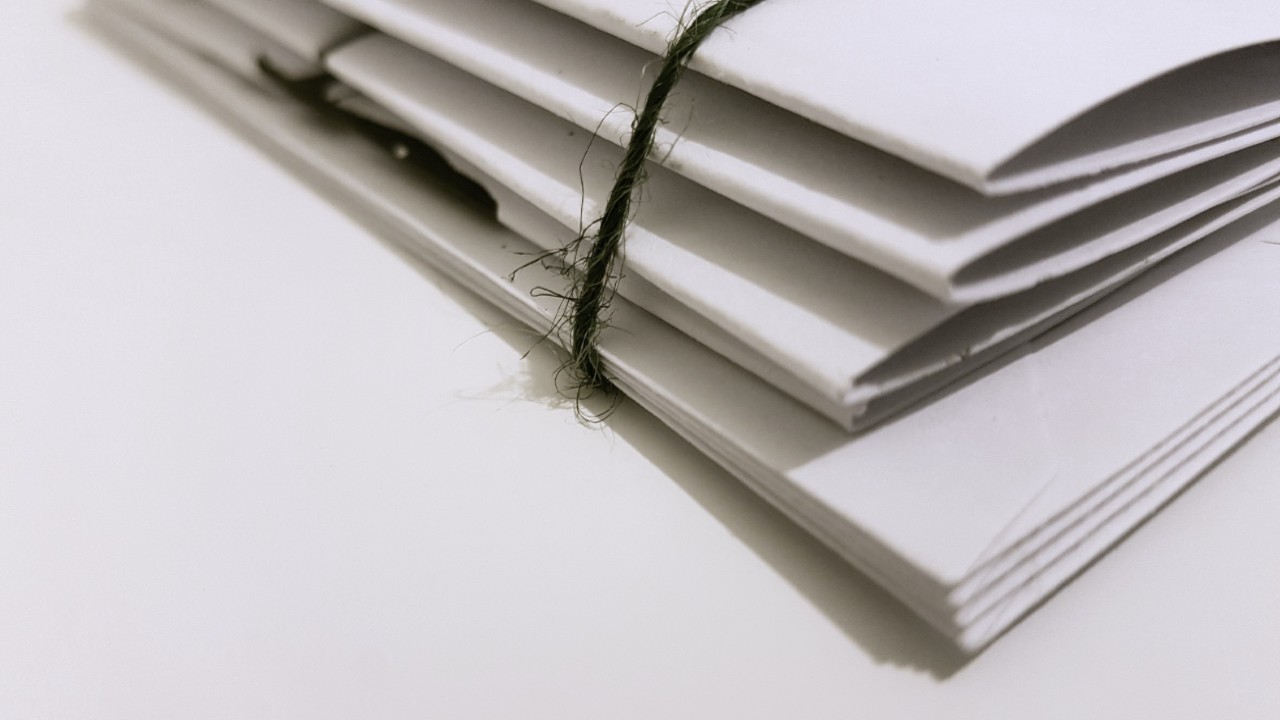 A stack of bound documents.